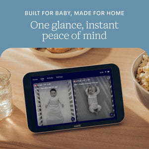 Baby monitor on a table with text 'Built for baby, made for home. One glance, instant peace of mind.'