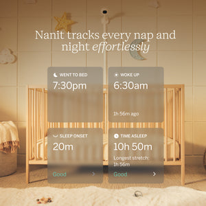 Nanit baby monitor display in a nursery with crib and decorative items.