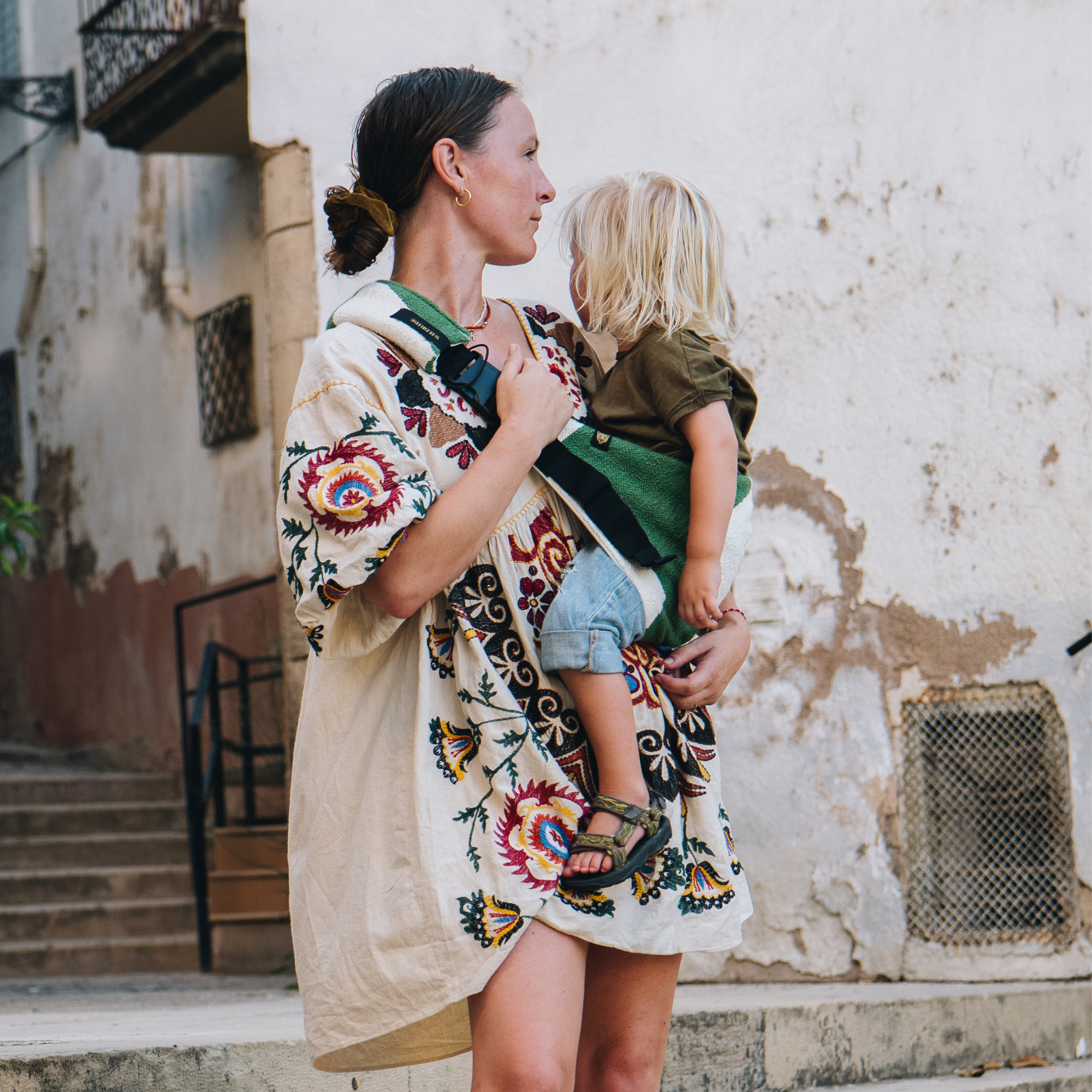 green graphic toddler carrier for moms